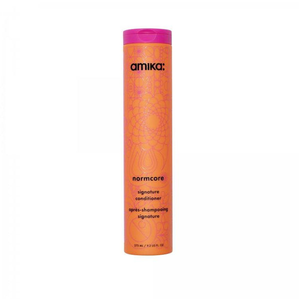 Amika Normcore signature conditioner bottle with sea buckthorn